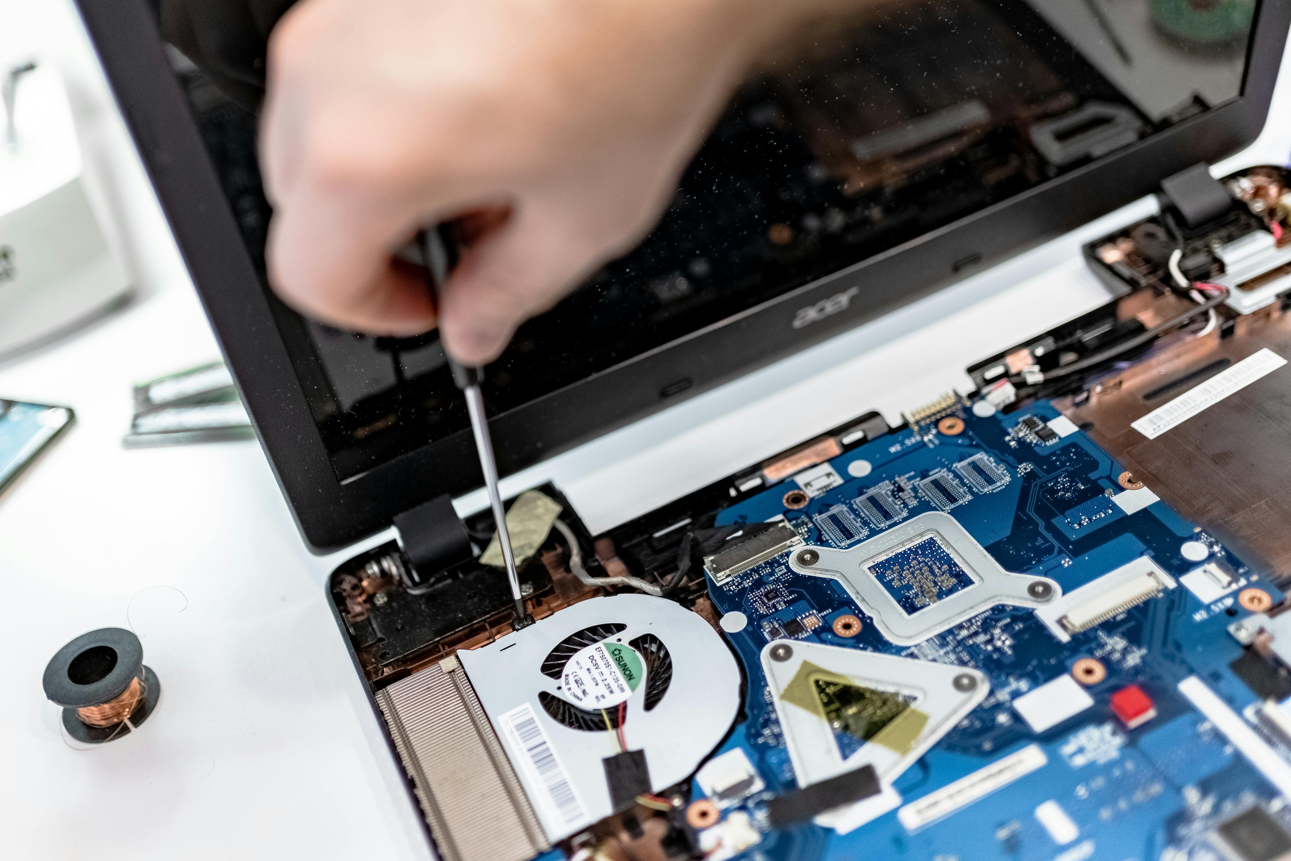 Technician repairing computer hardware